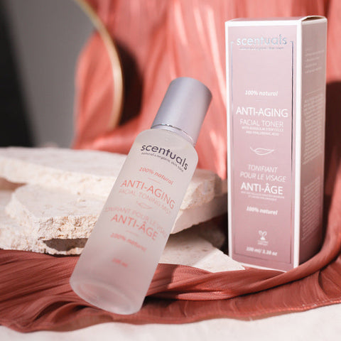 Scentuals anti-aging facial toner bottle and packaging on a soft fabric background